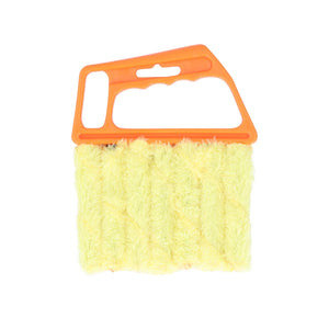 Gelbe Reinigungsbürste mit orangenem Griff